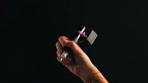 Close-up of a tattoo artist's hand with a typewriter Stock Footage 184034744