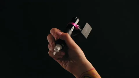 Close-up of a tattoo artist's hand with a typewriter Video stock 184035526