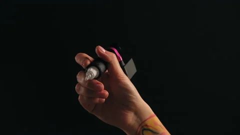Close-up of a tattoo artist's hand with a typewriter Stock Footage 184037091