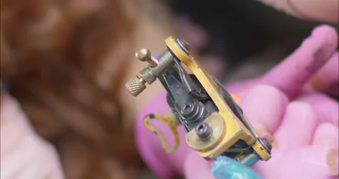 Close up of Tattoo Gun in slow motion Stock Footage
