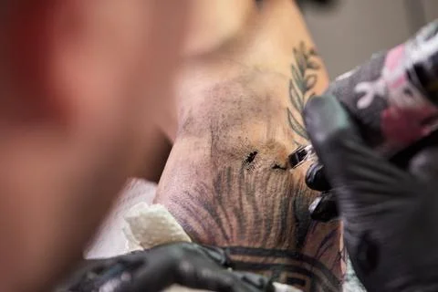 Close the tattoo machine. Tattoo image on arm by a professional tattoo artist Stock Photos