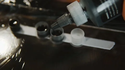 Close-Up Of A Tattoo Master Pours Ink Into Special Containers. Stock Footage 133534985