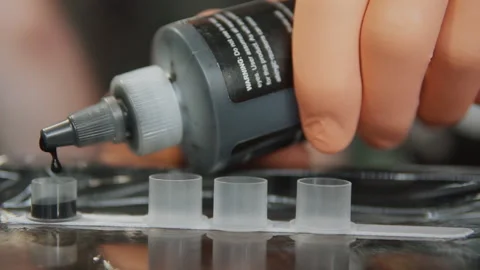 Close-Up Of A Tattoo Master Pours Ink Into Special Containers. Stock-Footage 133535360