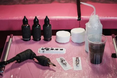 Close up of tattoo master tools. Needles, inks, petroleum jelly and disinfectant Foto stock