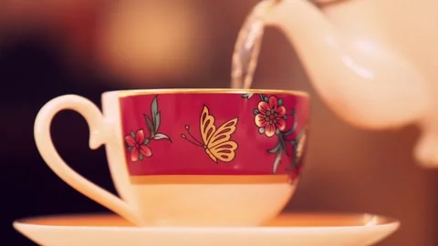 Close Up Of Tea Being Poured Into A Cup, at an Afternoon Tea, London, UK Stock Footage 296038730