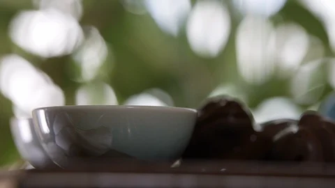 Close-up of tea ceremony. Chinese tea is poured in small cups. Chinese culture  Stock Footage 105644435