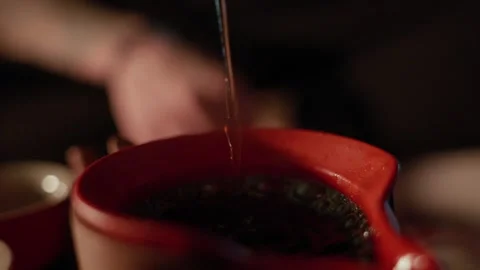 Close-Up Tea Pour with Rising Bubbles Stock Footage 321933348