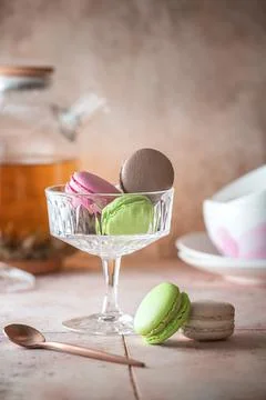 Close-up tea time composition with colorful macaroons. Stock Photos