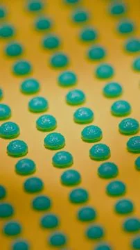 Close-up teal 3D brain models in repeating pattern on yellow background.. Stock Photos