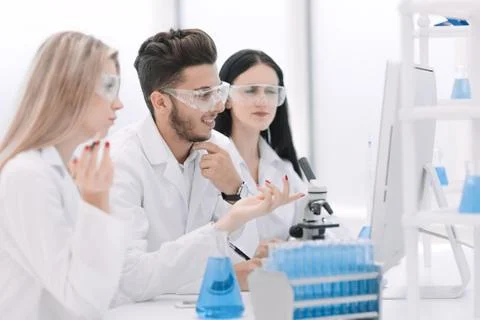 Close up.a team of scientists use a computer to check the data Stock Photos