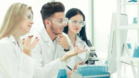 Close up.a team of scientists use a computer to check the data Stock Photos
