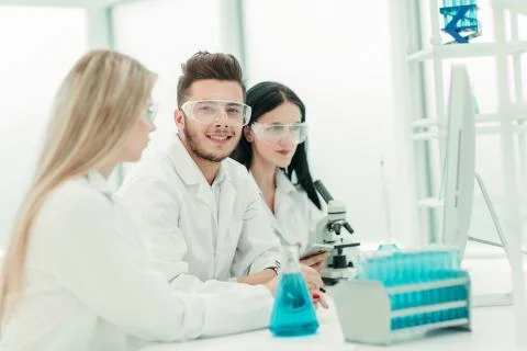 Close up.a team of scientists use a computer to check the data Stock Photos