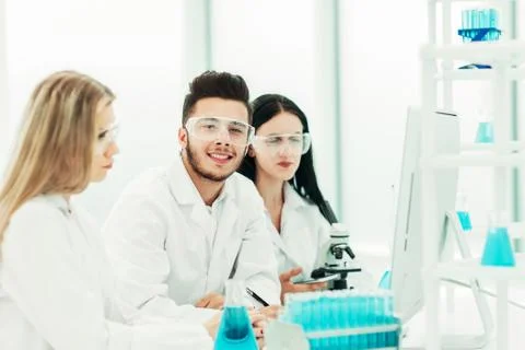 Close up.a team of scientists use a computer to check the data 스톡 사진