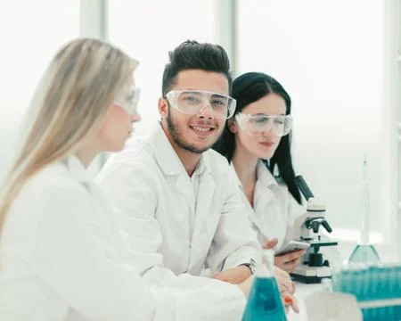 Close up.a team of scientists use a computer to check the data Foto stock