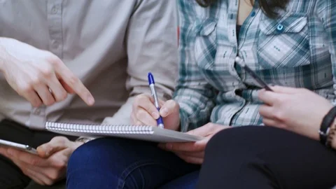 Close-up of team writing a business plan at the office Stock Footage 75552744
