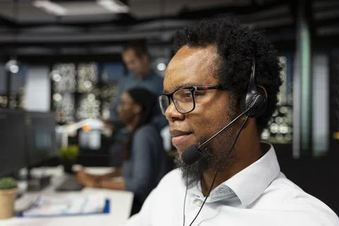 Close up of tech support employee in office resolving technical issues 写真素材