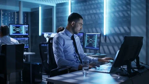 Close-up of Technical Engineer Working on His Computer With Multiple Displays Stock Footage