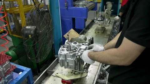 Close Up Of Technician Assembling Aluminum Engine Crankcase In Factory 스톡 동영상 342579728