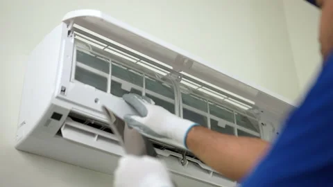 Close-up technician in blue uniform using tablet to check list of maintenance. Stock Footage 234257342