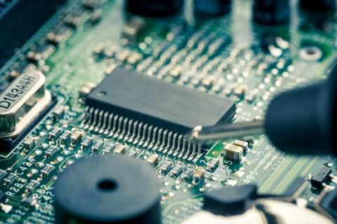 Close Up - Technician engineer measuring multimeter computer circuit board Stock Photos