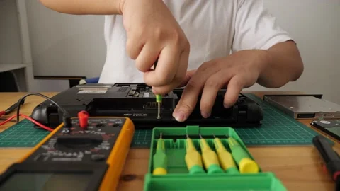 Close up of technician engineer trying to repairing broken laptop. Computer r Stock Footage 152717879