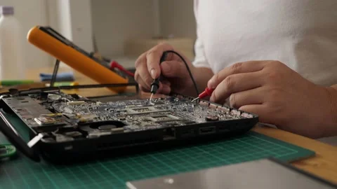 Close up of technician engineer trying to repairing broken laptop. Computer r Stock Footage 152718517