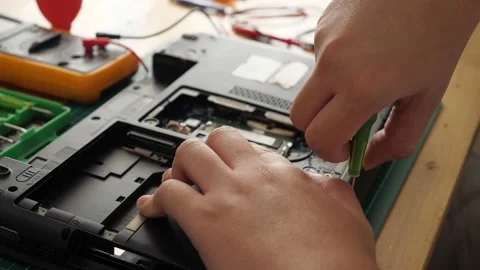 Close up of technician engineer trying to repairing broken laptop. Computer r Stock Footage 152718569