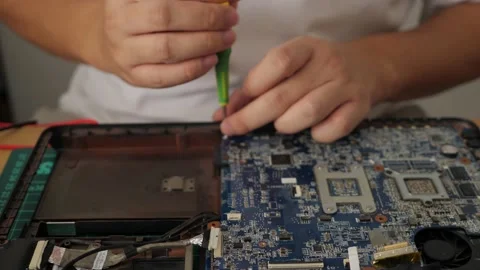 Close up of technician engineer trying to repairing broken laptop. Computer r Stock Footage 152718691