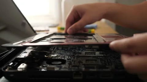 Close up of technician engineer trying to repairing broken laptop. Computer r Stock Footage 152718708