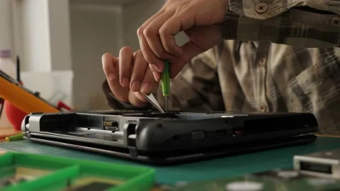 Close up of technician engineer trying to repairing broken laptop. Computer r Stock Footage 152718724