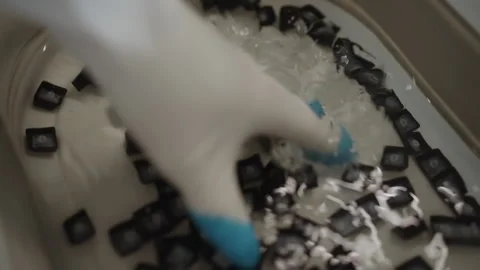 Close-up of technician gloved hand cleaning and disinfecting mechanical keyboard Stock-Footage 342767955