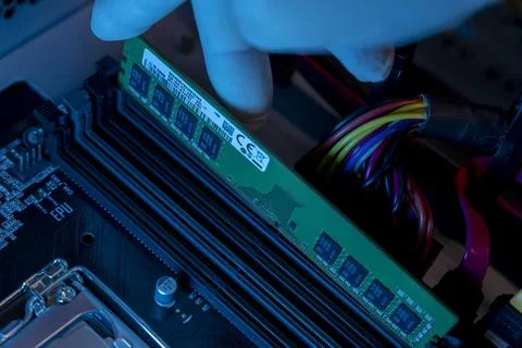 Close-up of technician hand with gloves installing ram memory slot Stock Photos