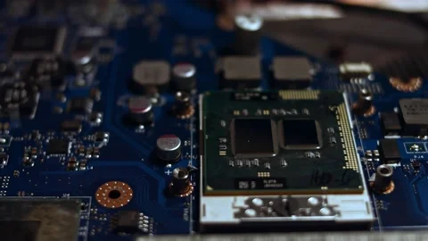 Close-up of technician male hands in gloves using screwdriver to install CPU to Stock Footage 143163380