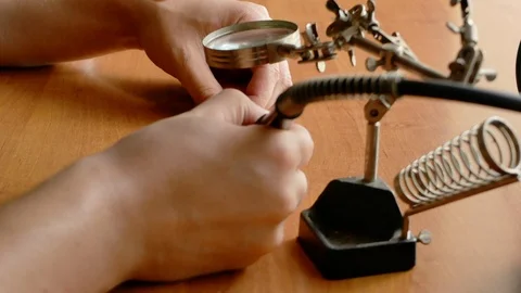 Close-up of technician man's hands do some repair or craft Stockbeeldmateriaal 116057116