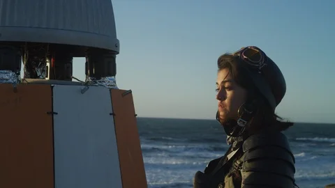 Close-up of technician measuring the spaceshuttle model on the beach Stock Footage 108963856