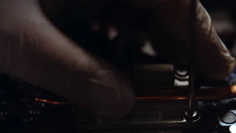 Close-up of technician removing cooling system from CPU Stock Footage 143163222