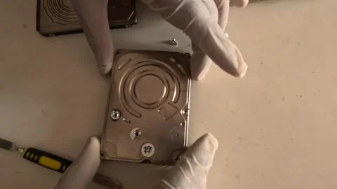 Close-up of a technician restoring a hard disk Stock Footage 247818103