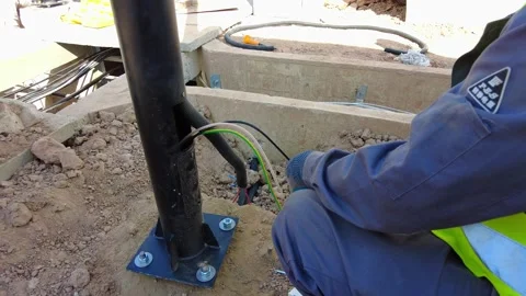 Close up of a technician routing and terminating electrical wires through a Stock Footage 342467293