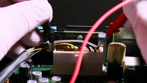 Close-up of Technician Testing Electronic Circuit Board with Multimeter Pro.. Stock Footage 309698369