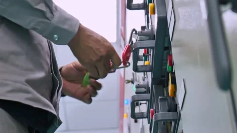 Close-up of a technician unlocking a safety padlock used for hazardous energy is 스톡 동영상 336566064
