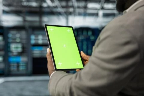 Close up of technician using isolated screen tablet in data center Stock Photos