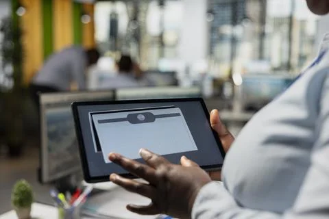 Close up of technician using tablet to build solar powered prototype Stock Photos