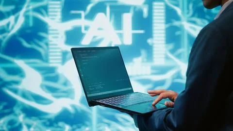 Close up of technician writing code for AI applications development Stock Photos