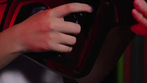 Close-up of a teenagers hand on the trigger of a weapon while playing laser tag Stock Footage 321814281