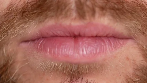 Close-up of teeth. A man shows his denture on two teeth. There are not enough Stock Footage 81990655