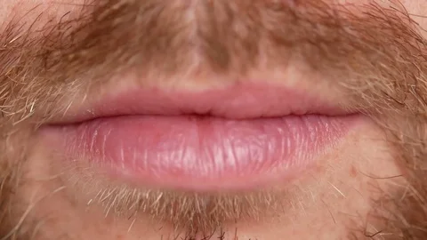 Close-up of teeth. A man shows his denture on two teeth. Stock Footage 83399524