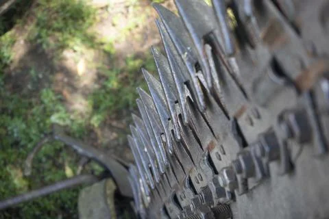 Close-up of teeth on a tractor plow. Selective focus Stock Photos