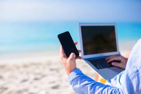 Close up telephone on background of computer at the beach Stock Photos