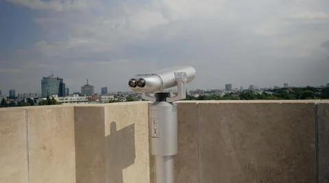 Close up of telescope on skyscraper rooftop Фото