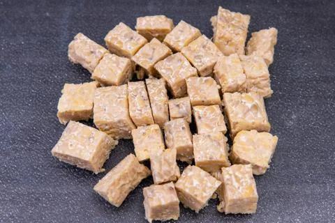 Close up of tempeh cut into small cube pieces. Stock Photos
